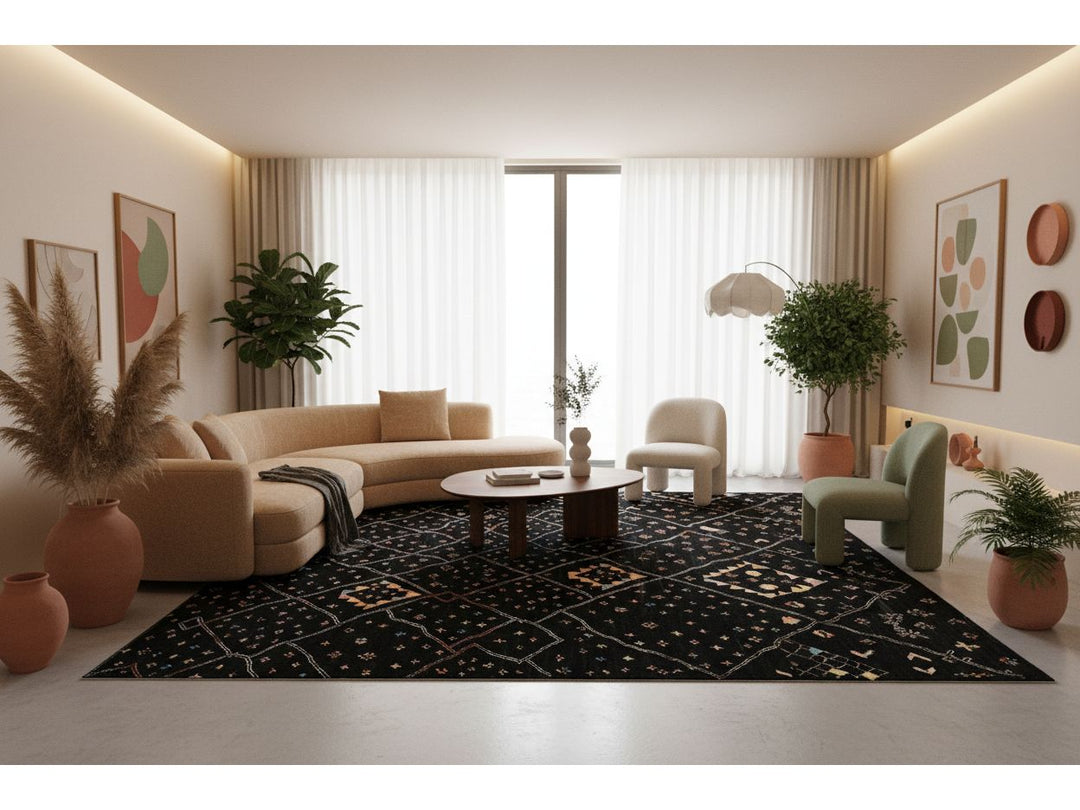 Modern living room with a black patterned rug, beige sofa, and decorative plants.