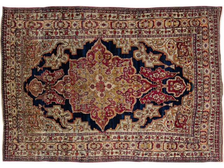 Antique Kerman Handmade Red and Blue Floral Medallion Motif Wool Rug